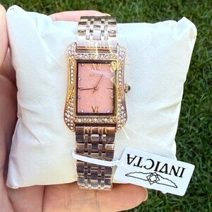 Rose Gold watch with pink watch face and diamond inspired stones around face